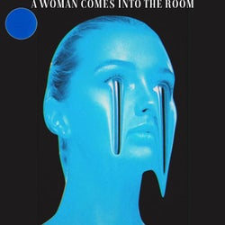 A WOMAN COMES INTO THE ROOM