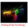 Holding On By The Strings